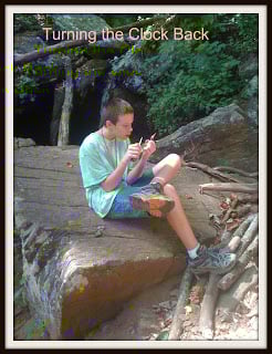 boy sitting on rock during hike in georgia mountains