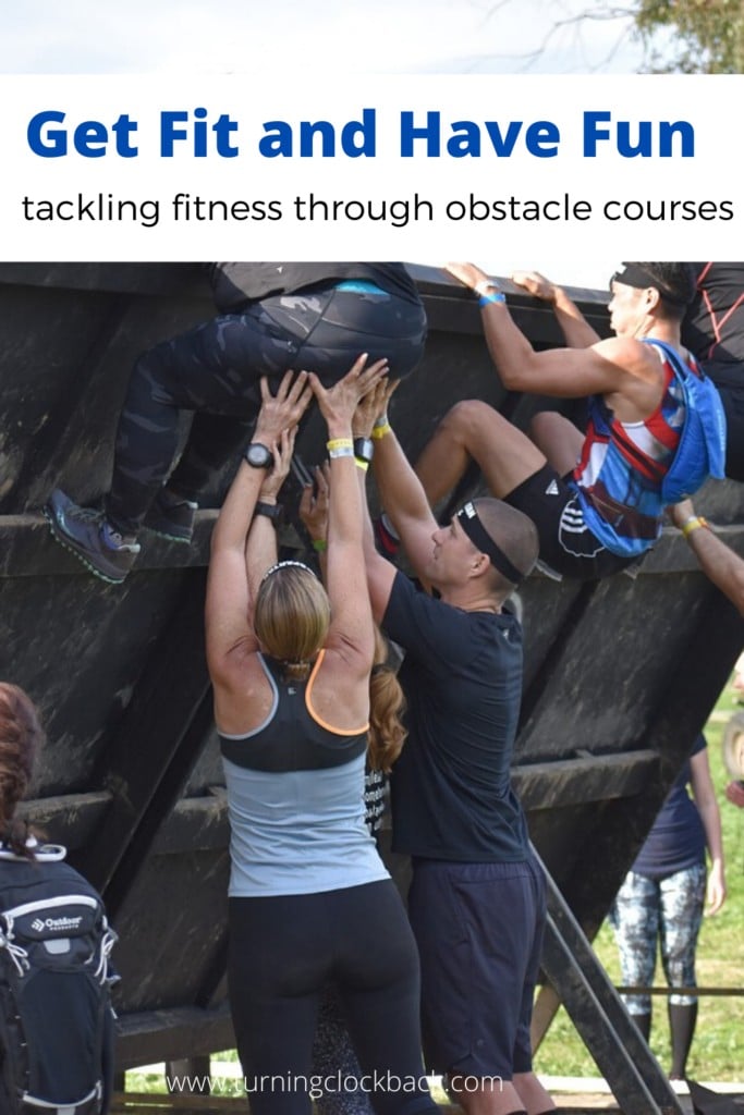 group of people tackling obstacle course with text Get Fit and Have Fun tackling fitness through obstacle courses