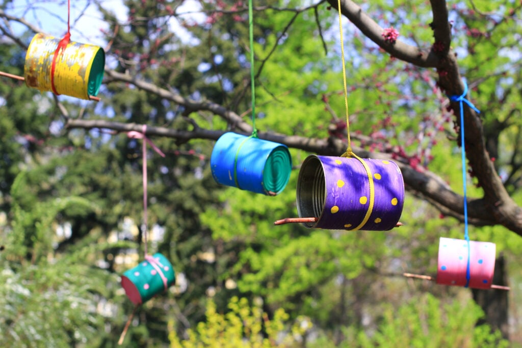 tin can bird feeders in a tree