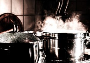 pot simmering on stove to indicate hot kitchen