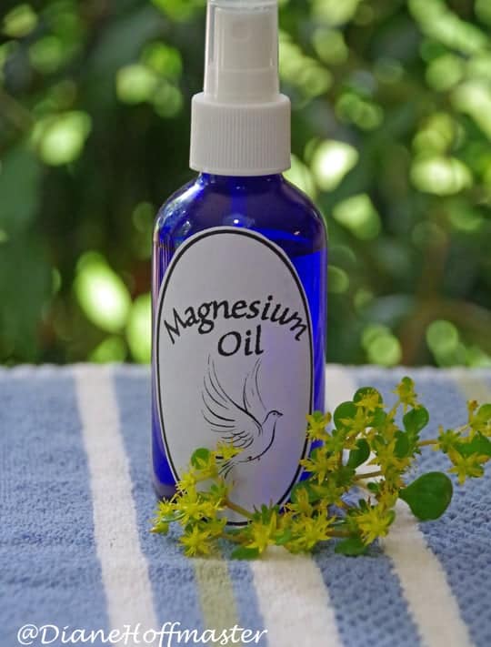 bottle of diy magnesium oil on a towel