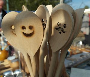 old wooden spoons carved with faces
