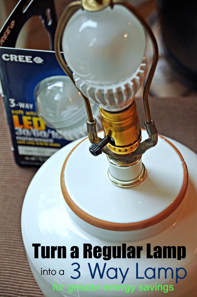 close up of lamp socket with 3 way lightbulb in back and text overlay 'How to turn a regular lamp into a 3 way lamp'