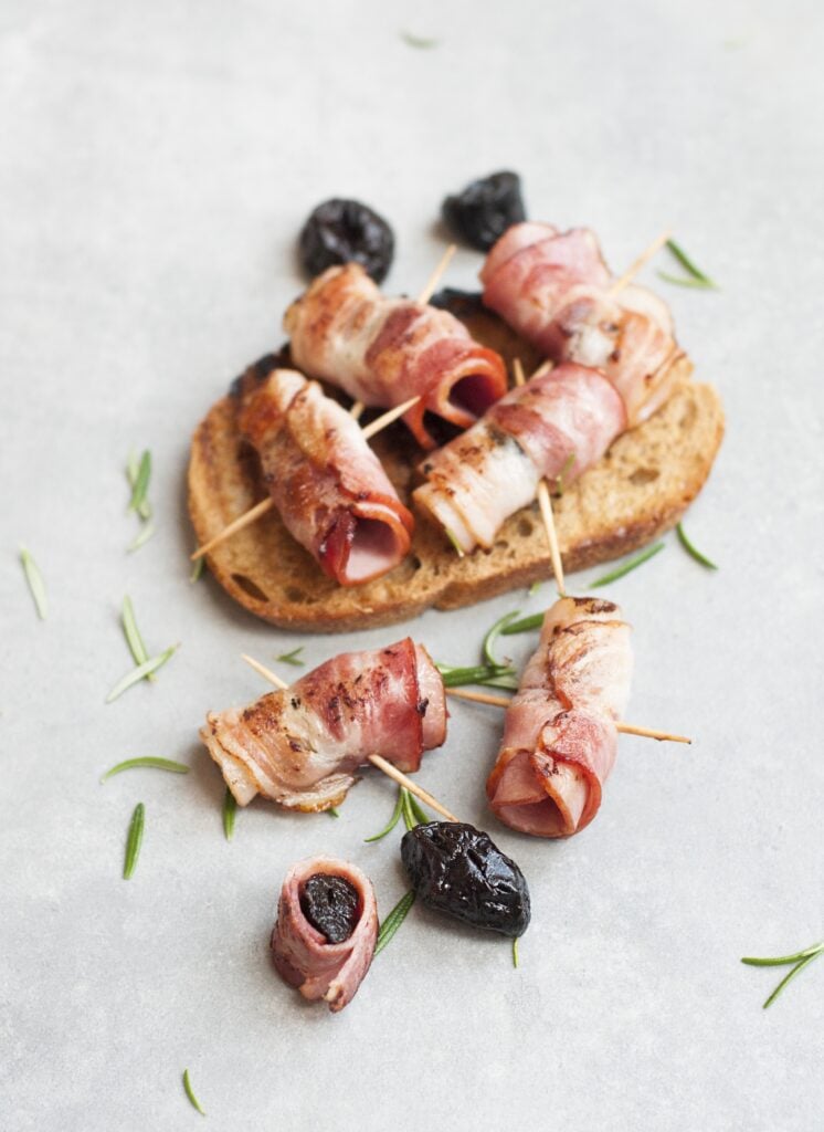 bacon date appetizer on toothpick with bread