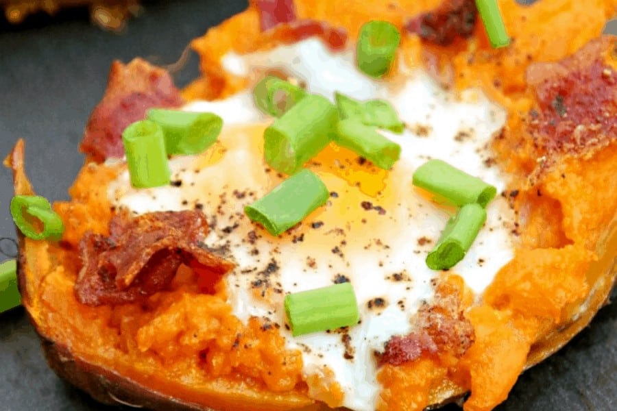 baked sweet potato with egg bacon and green onions