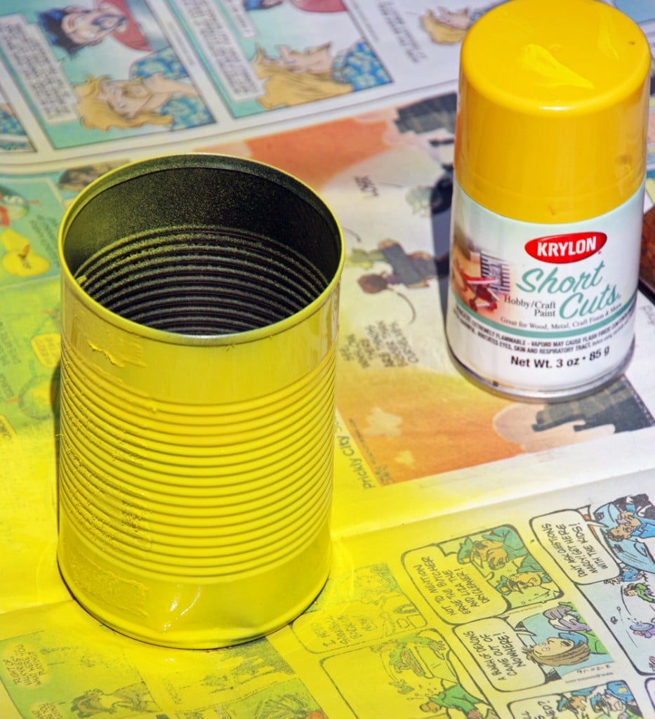 tin can and yellow spray paint