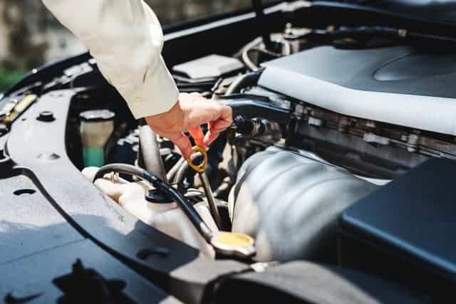 automobile engine being checked