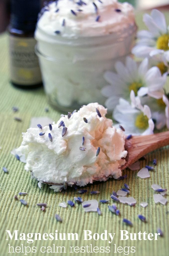 closeup of Magnesium Body Butter on a small wooden spoon 