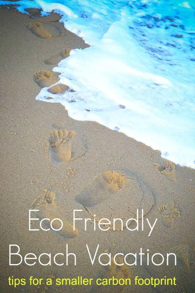 Footprints in the sand with text overlay ‘Beach Vacation Tips for a Smaller Carbon Footprint’