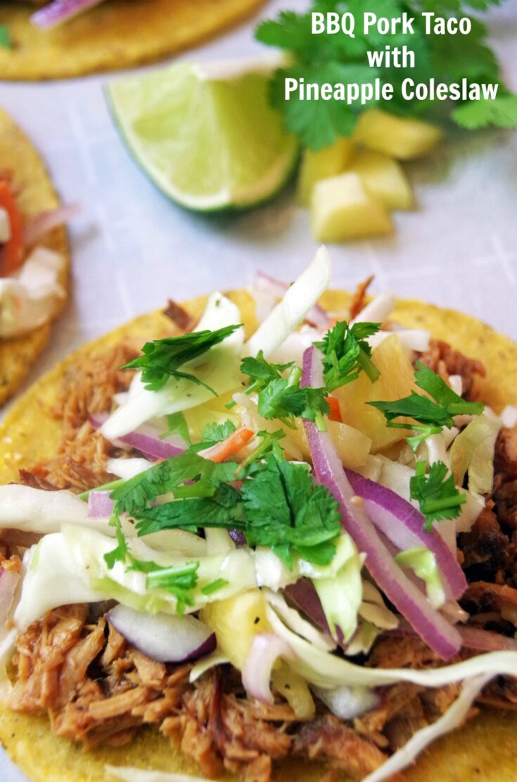 BBQ Pulled Pork Taco Recipe with Pineapple Coleslaw. This easy Mexican recipe is perfect for Taco Tuesday, Cinco de Mayo or any day that needs a fiesta flavor