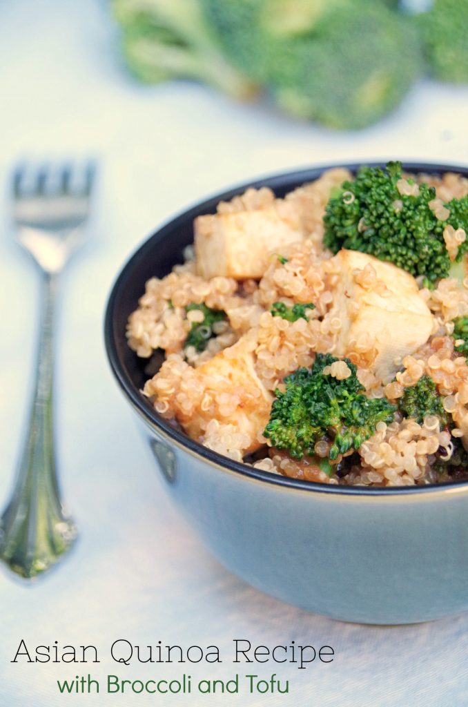 bowl of Asian Quinoa Recipe with Broccoli and Tofu on white table with fork