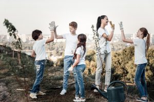 Positive joyful team giving each other high fives