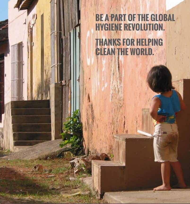 small child standing near run down house