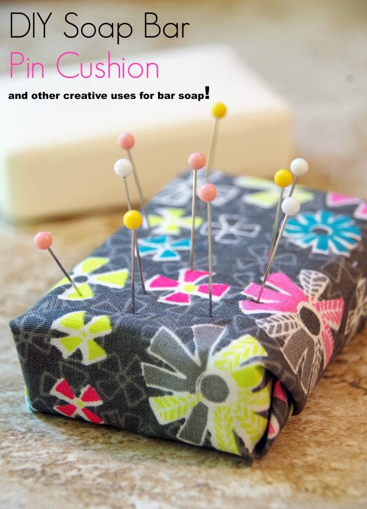 pin cushion made out of an old bar of soap with pins in it