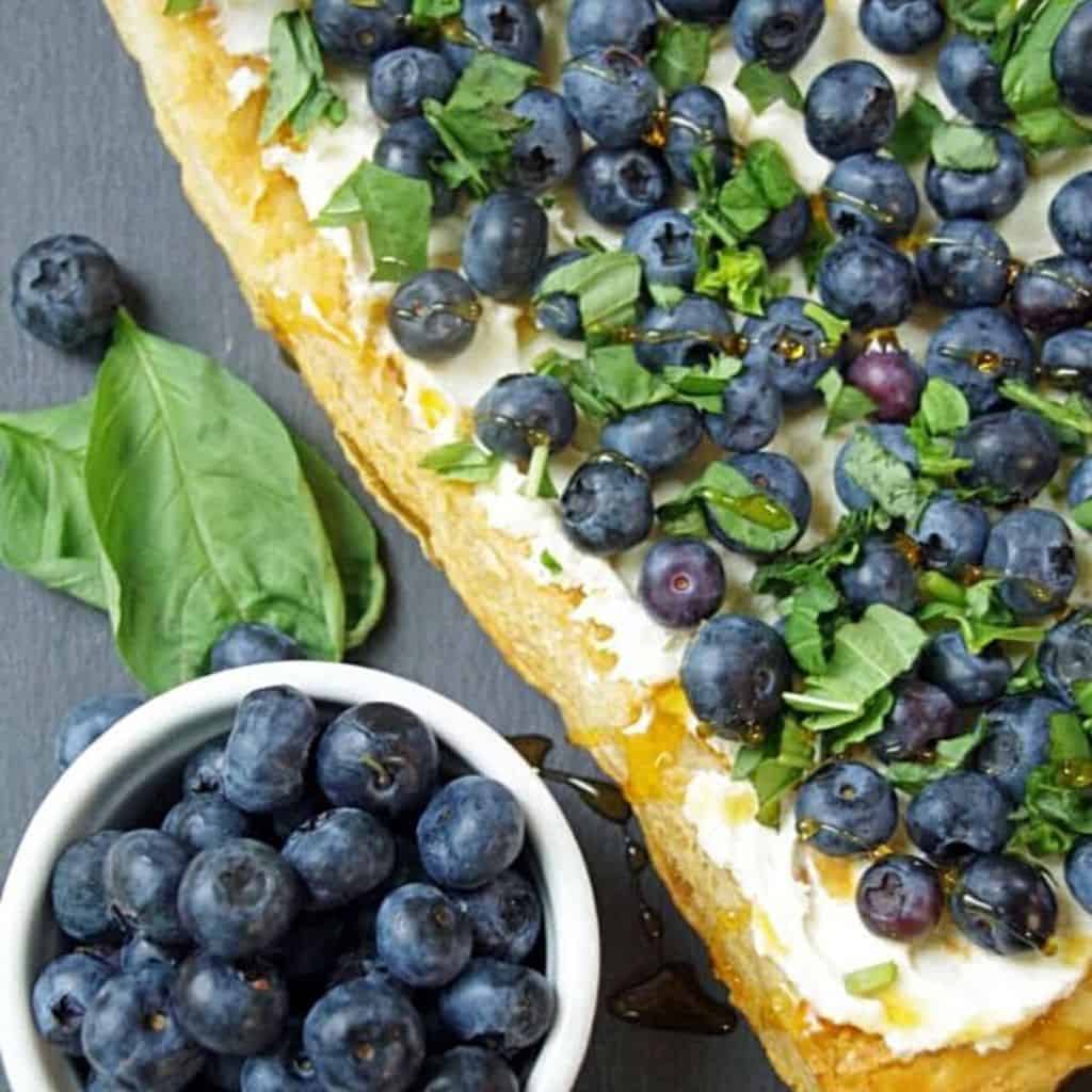 blueberry tart with puff pastry on a slate surface