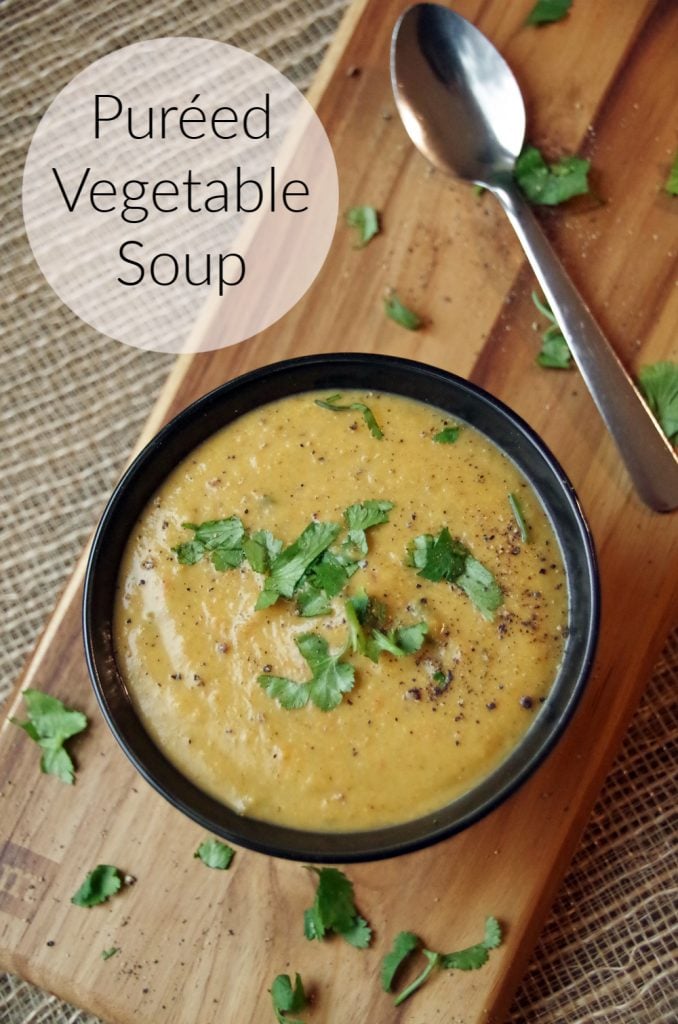 Pureed Vegetable Soup in a small bowl on a cutting board