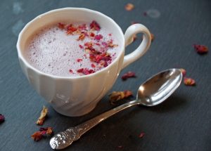 Tart Cherry Moon Milk in white mug with dried rose petals