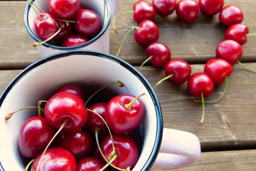 cherries in a mug and in the shape of a heart