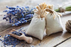 Bunch of lavender flowers and sachets filled with dried lavender.