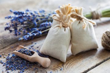 Bunch of lavender flowers and sachets filled with dried lavender.
