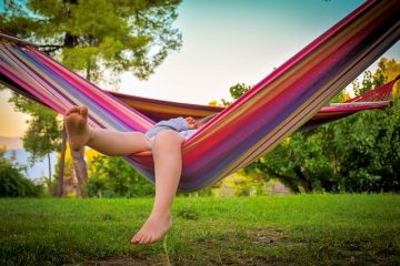 kid in hammok in summer