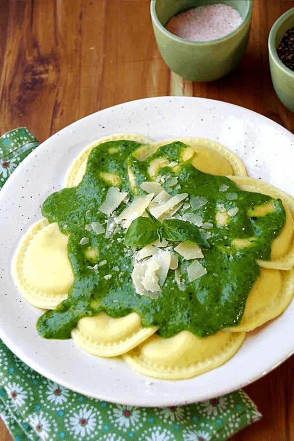 Pasta with Spinach pasta sauce, Parmesan cheese and basil