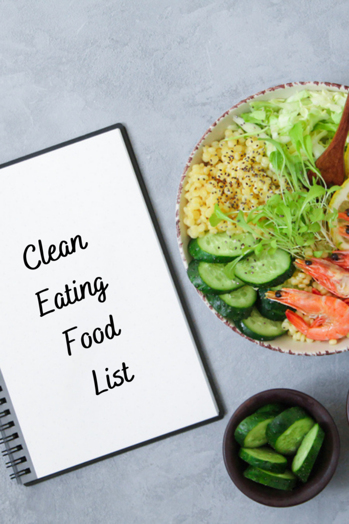 healthy food in a bowl next to a notebook that says clean eating food list