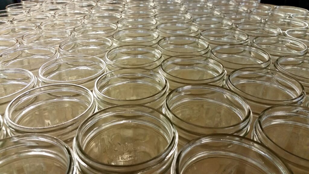 collection of empty glass mason jars