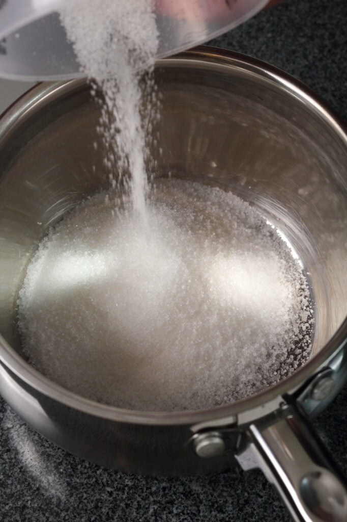 Pouring Sugar into a pan