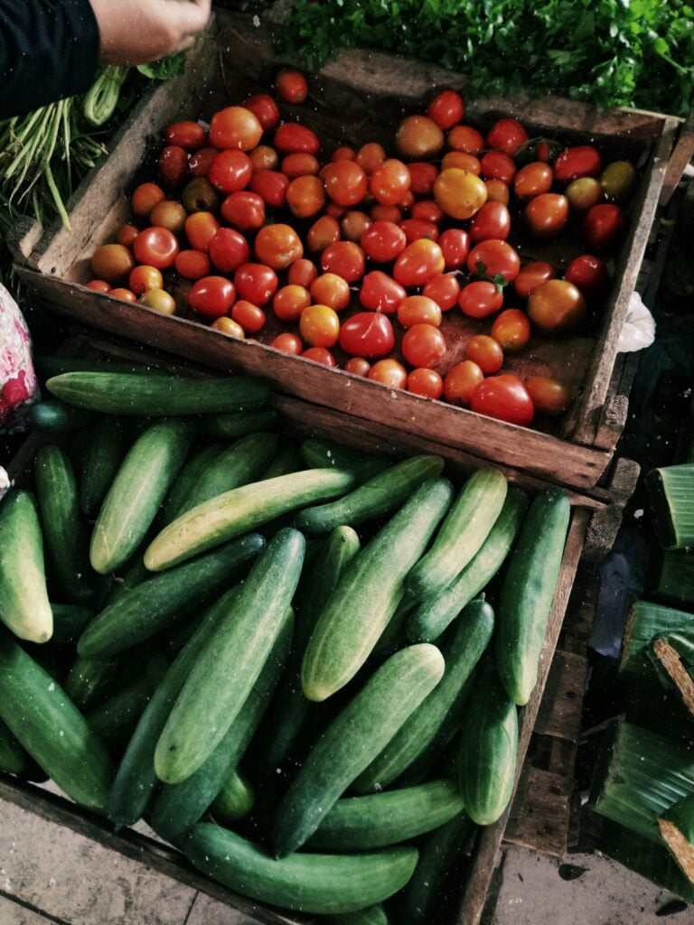 organic produce in baskets at a farmers market