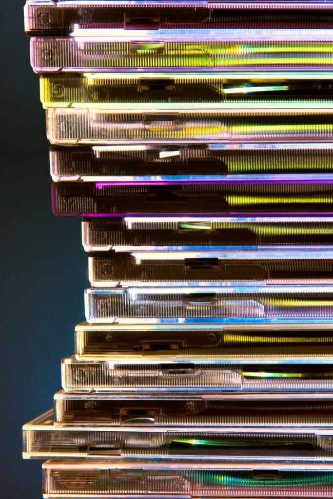 closeup of a pile of old plastic compact disc cases